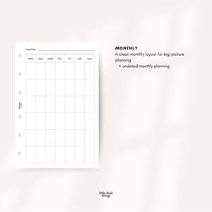 May include: A white monthly planner page with a grid layout for daily planning. The page includes the days of the week across the top and is designed for big-picture planning. The text "MONTHLY" is displayed at the top.