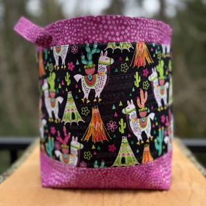 May include: A rustic wooden sign with the text "Welcome to our home" in white lettering. The sign features a distressed finish and a simple, inviting design, perfect for a front porch or entryway.