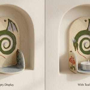 May include: Ceramic candle holder with a dragon design. The holder is off-white with a green dragon, red tongue, and purple wings. A tealight candle sits in the holder in the second image. The text "Empty Display" and "With Tealight" are below the images.