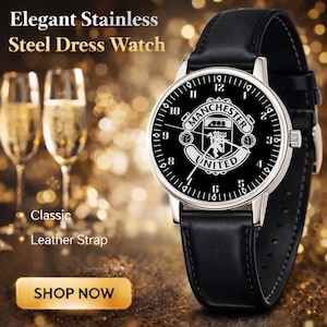 May include: Elegant stainless steel dress watch with a black leather strap. The watch face is black with white numerals and the Manchester United logo. The watch has a silver-colored bezel and a classic design.