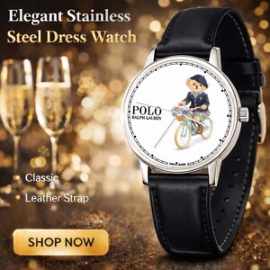 May include: Elegant stainless steel dress watch with a black leather strap. The watch face features a Polo Ralph Lauren design with a bear riding a bicycle. The watch has a silver case and is labeled "Swiss Made".