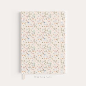 May include: A hardcover notebook with a cream-colored background featuring a repeating pattern of white geese wearing blue, green, or pink bows, interspersed with small green leafy sprigs and tiny pink flowers. The spine is a solid cream color.