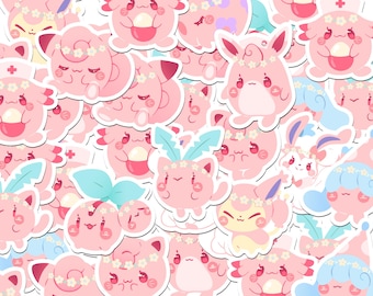 May include: A collection of pink stickers featuring various cartoon characters with floral crowns and other decorative elements. The stickers have a white border and are arranged in a repeating pattern. Some characters have blue or red accents.