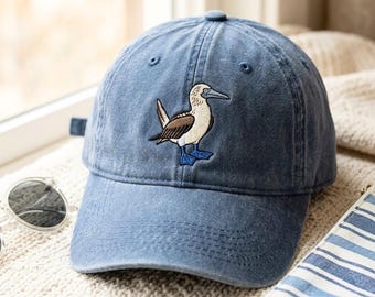 Kappe aus gewaschener Baumwolle mit besticktem Blaufußtölpel – Einheitsgröße