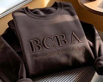 BCBA認定行動分析士スウェットシャツ、ミニマルな同系色シャツ
