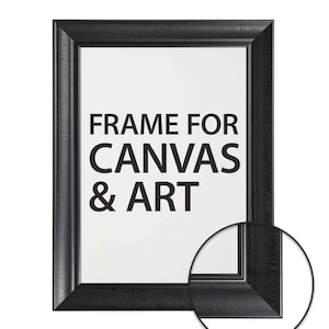 Puede incluir: Un marco de fotos negro con el texto "FRAME FOR CANVAS & ART" en negrita, letras negras. El marco tiene una superficie texturizada. Se muestra un primer plano de la esquina del marco en un círculo.