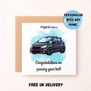 Peut inclure: Carte de vœux avec une illustration de voiture noire, des détails rouges et un permis de stationnement. Le texte comprend "Félicitations pour avoir réussi votre test !" et "Personnalisez avec n'importe quel nom".