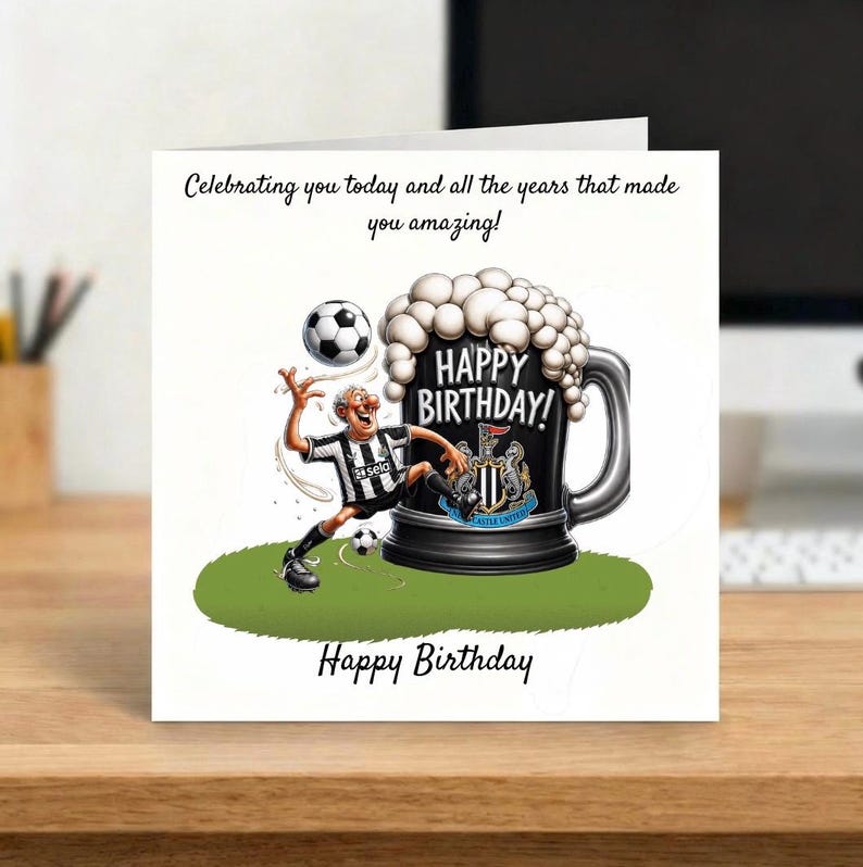 May include: A birthday card featuring a cartoon of a soccer player kicking a ball. The player is in a black and white striped jersey. A large beer mug with the words "Happy Birthday" is next to the player. The card has the text "Celebrating you today and all the years that made you amazing!" and "Happy Birthday".