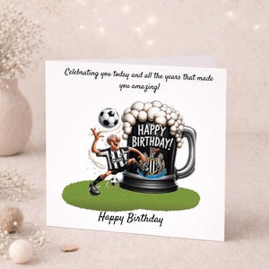 May include: A birthday card featuring a cartoon of a soccer player kicking a ball towards a large beer mug with the words "Happy Birthday!" The card has the text "Celebrating you today and all the years that made you amazing!" and "Happy Birthday".