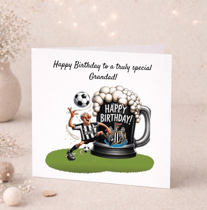 May include: A birthday card featuring a cartoon illustration. The card shows a soccer-themed design with a soccer player kicking a ball, a large beer mug with the words "Happy Birthday!" and the text "Happy Birthday to a truly special Grandad!"