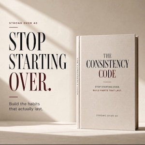 May include: A hardback book titled The Consistency Code with a beige fabric cover. The front cover features black and dark red text that reads: The Consistency Code, Stop starting over. Build habits that last. Strong Over 40. The spine also shows text.