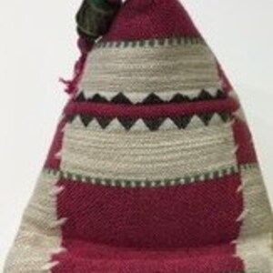 May include: A small, triangular, red and beige patterned fabric pouch with a green and brown wooden bead at the top.