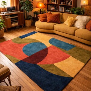 May include: A colorful area rug with a geometric design. The rug features a combination of shapes in shades of red, blue, yellow, and green. The rug is placed on a wooden floor, and the room has a warm, inviting atmosphere.