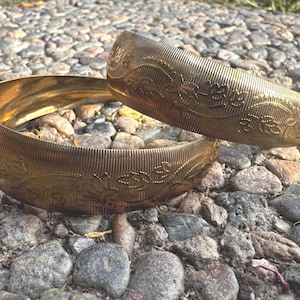 May include: A rustic wooden sign with the text "Welcome to our home" in white lettering. The sign features a distressed finish and a simple, inviting design, perfect for a front porch or entryway.