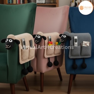 May include: Crocheted sheep-shaped armrest organizers in beige and gray, with black accents. Each organizer has pockets for remote controls and other small items. The sheep have black and white eyes and dangling black pom-poms.