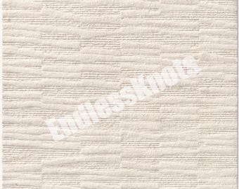 Könnte beinhalten: Ein rechteckiger Teppich in einem einfarbigen Off-White mit einem strukturierten Muster aus abwechselnden horizontalen und vertikalen erhabenen Linien. Der Text EndlessKnots ist in weißer Schrift diagonal über die Mitte gedruckt.