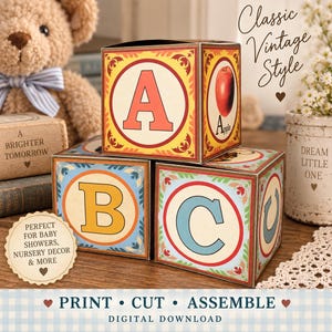 May include: Three square paper blocks featuring the letters A, B, and C in a vintage style. The block with the letter A displays a red apple illustration. The blocks are decorated with colorful borders and patterns, designed for assembly.