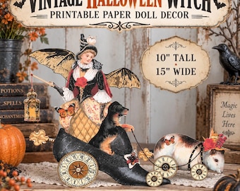 May include: A printable paper doll decor set featuring a witch in a black hat and bat wings, riding in a black shoe-shaped carriage pulled by a dog. The set includes text reading VINTAGE HALLOWEEN WITCH, 10" TALL 15" WIDE, and PRINT, CUT, ASSEMBLE, DECORATE.