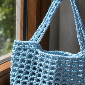 A close up view of crochet tote bag