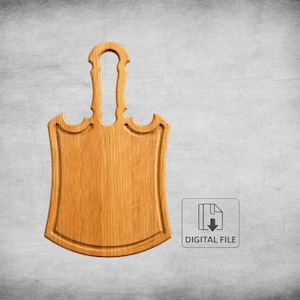 Puede incluir: Una tabla de cortar de madera con asa, con forma de escudo. La tabla es de madera clara y tiene un asa decorativa. La imagen incluye el texto "DIGITAL FILE".