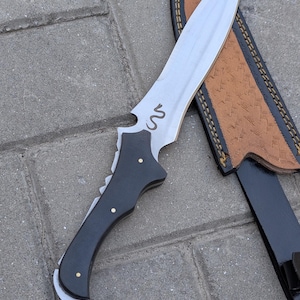 May include: A rustic wooden sign with the text "Welcome to our home" in a handwritten style. The sign features a distressed finish and a simple, inviting design, perfect for a front porch or entryway.