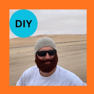 May include: A crocheted beard and beanie set in shades of brown and gray. The beard is a textured, full style, and the beanie is a close-fitting cap. The word "DIY" is in a blue circle in the upper left corner.