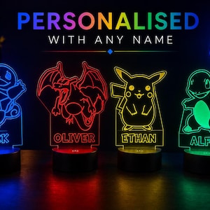 May include: Personalised LED night lights with cartoon character designs, each displaying a name. The lights glow in blue, red, yellow, and green, with the text "PERSONALISED WITH ANY NAME". A gaming controller is in the background.