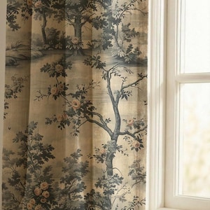May include: A curtain panel featuring a beige background with a repeating dark blue and grey landscape print of trees and foliage interspersed with soft pink rose blossoms. The fabric hangs vertically, displaying a detailed botanical pattern.