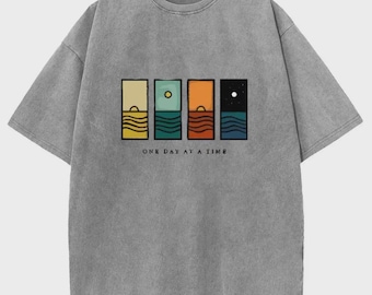 Camiseta vintage com estampa vintage, modelagem oversized em algodão pesado, estilo streetwear retrô.