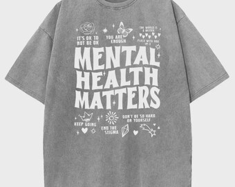 Camiseta vintage com estampa "Saúde Mental Importa", modelagem oversized, estilo streetwear.