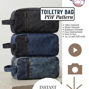 May include: Three rectangular toiletry bags stacked vertically, each featuring a side handle and a front zipper. The top bag is charcoal gray, the middle is dark blue denim, and the bottom is light blue acid-wash denim. Text reads TOILETRY BAG PDF Pattern.