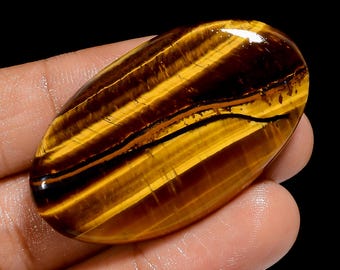 Cabochon Occhio di Tigre con retro piatto e lati lucidati, cristallo di tigre, dimensioni 44x25x5 mm, pietra Fireplay.
