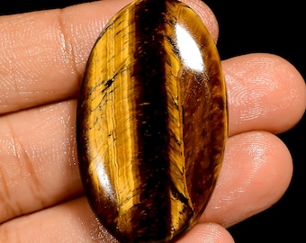 Cabochon Occhio di Tigre con retro piatto e lati lucidati, cristallo di tigre, dimensioni 40x23x6 mm, pietra Fireplay.