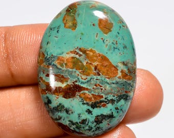 Cabochão de turquesa cobre do Arizona, polido em ambos os lados, medindo 32 x 23 x 6 mm.