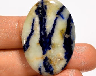 Cabochão de pedra afegã, base plana, polida e cristal azul afegã, dimensões 34 x 24 x 5 mm.