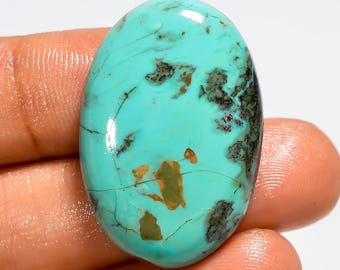 Cabochão de turquesa cobre do Arizona, polido em ambos os lados, medindo 31 x 21 x 6 mm.