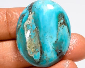 Cabochão de turquesa cobre do Arizona, polido em ambos os lados, medindo 30 x 24 x 7 mm.