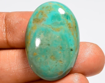 Cabochão de turquesa cobre do Arizona, polido em ambos os lados, medindo 29 x 20 x 7 mm.