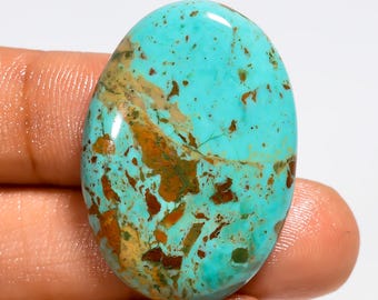 Cabochão de turquesa cobre do Arizona, polido em ambos os lados, medindo 33 x 23 x 5 mm.