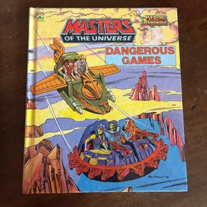 Masters of the Universe Hardcover-Bücher - Gefährliche Spiele, Tesla’s Geheimnis, Neue Meister von Eternia Buch Dangerous Games