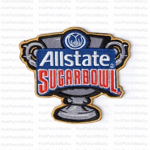 May include: Embroidered patch with the text "Allstate Sugar Bowl" in red and white on a blue panel. The patch is shaped like a trophy with a gold border and grey details. Suitable for application on clothing or accessories.