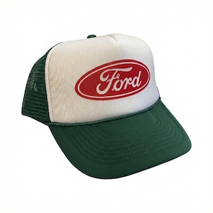 May include: A green and white trucker hat featuring the Ford logo in red. The hat has a white front panel with the Ford logo in a red oval, a green brim, and a green mesh back.