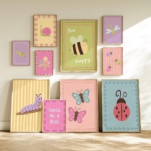 May include: A collection of ten rectangular wall art prints featuring colourful illustrations of insects and flowers. The prints include a snail, a bee with the text Bee Happy, a dragonfly, beetles, a caterpillar, butterflies, and a ladybug.