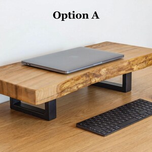 Live edge monitor stand made from solid ash wood with natural wood grain, rustic desk shelf for home office workspace, wooden monitor riser designed to elevate laptop or monitor while organizing desk setup.