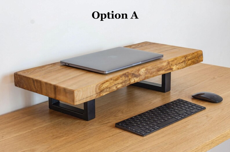 Live edge monitor stand made from solid ash wood with natural wood grain, rustic desk shelf for home office workspace, wooden monitor riser designed to elevate laptop or monitor while organizing desk setup.