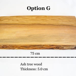 Live edge wood desk shelf designed as a monitor riser, handcrafted ash wood monitor stand for laptop desks and professional home office setups.