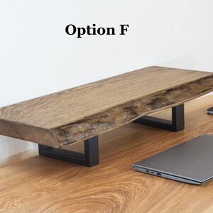 Solid ash wood desk shelf with natural live edge, wooden monitor stand designed for laptop or monitor setups, rustic desk organizer for modern home office workspace.