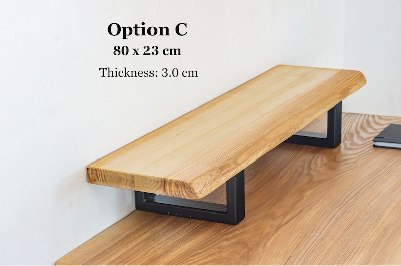 Solid ash wood desk shelf with natural live edge, wooden monitor stand designed for laptop or monitor setups, rustic desk organizer for modern home office workspace.