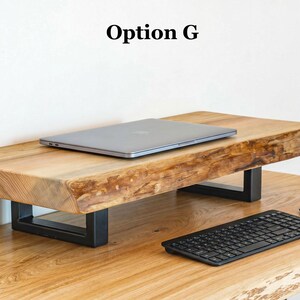 Rustic ash wood monitor stand with natural live edge design, solid wood desk riser that improves screen height and workspace organization.