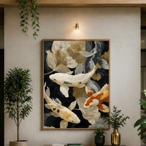 May include: A large rectangular wall art piece featuring a detailed painting of three koi fish swimming among abstract gold and dark blue floral shapes. The artwork is framed in a thin wooden border and hangs centered on a neutral-toned wall.